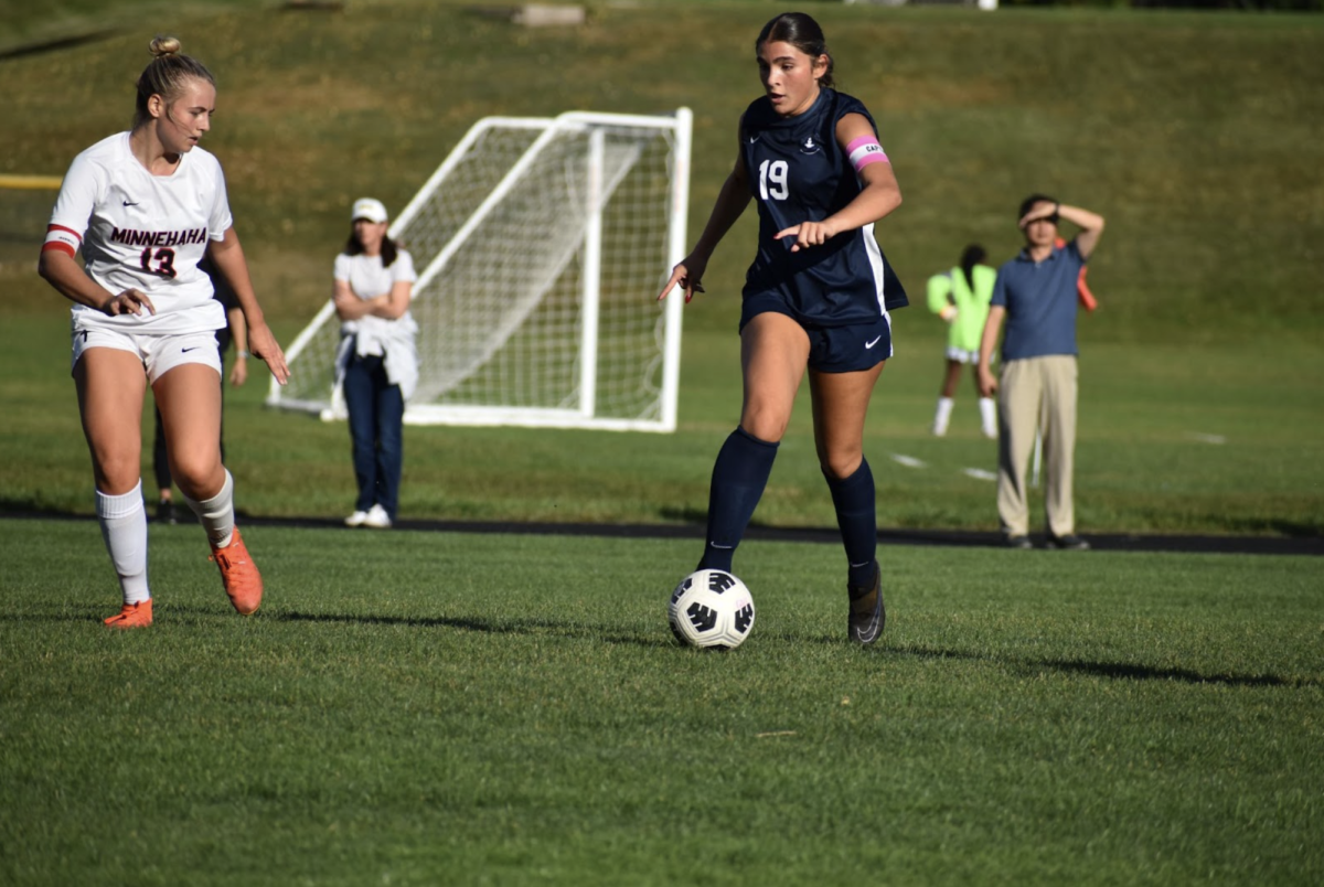 KEEP THE BALL. Junior and captain, Lucia Gonzalez, gets defended by a Redhawk captain as she strides to try and achieve a shot on goal. 
